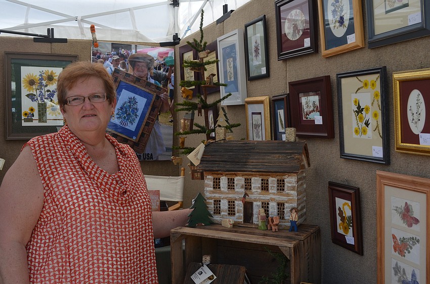Judy Boyer makes pressed flower pictures and he husband woodwork for the 1860 Wood Company.