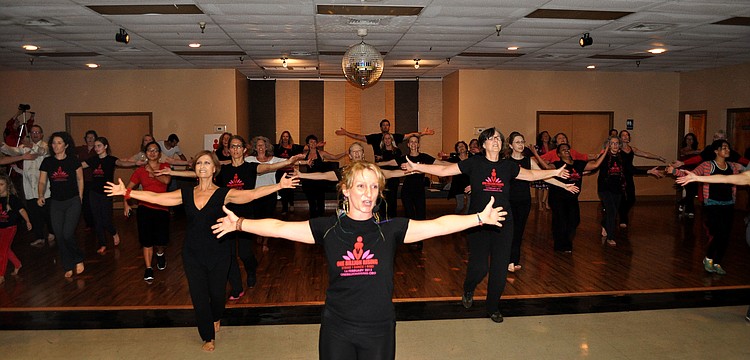 People follow Kelly Atkins in a guided dance to â€œBreak the Chainsâ€.