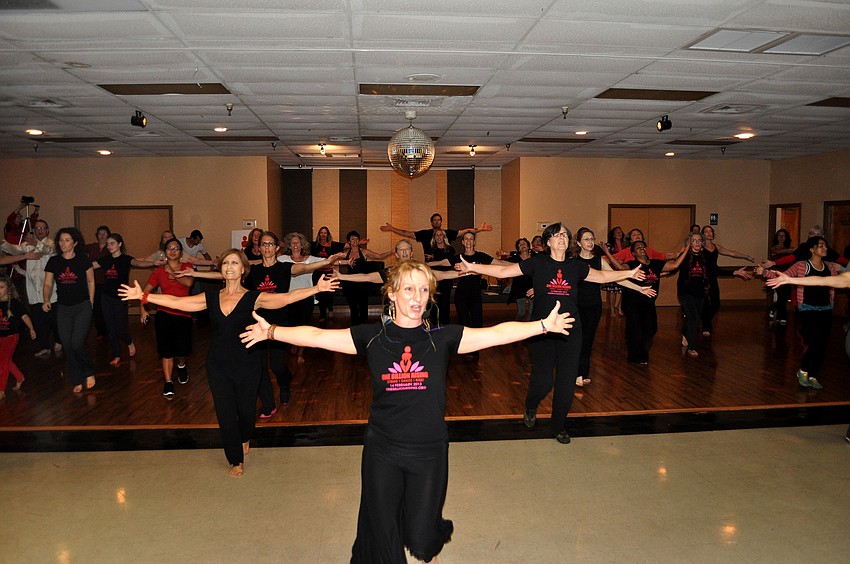 People follow Kelly Atkins in a guided dance to â€œBreak the Chainsâ€.