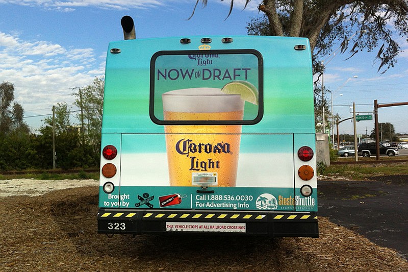 Siesta Shuttle Transportation launched its island transit service Feb. 16. Corona Light bought advertising on one of the firm's two buses.