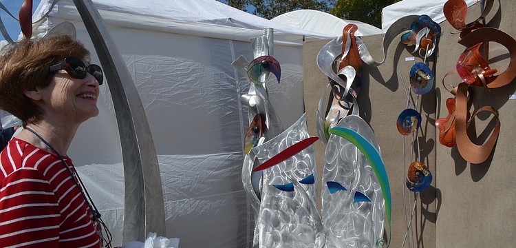 Barbara Steinfirst came from Bradenton to enjoy the various works at the festival.