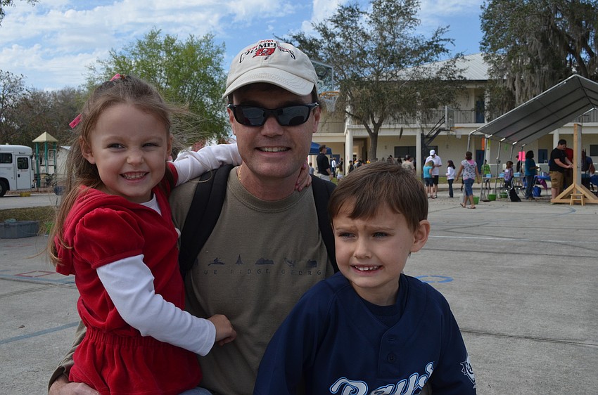 Madison Bogue, 3, and her brother Blake, 5, came to play some games with their father Bob.