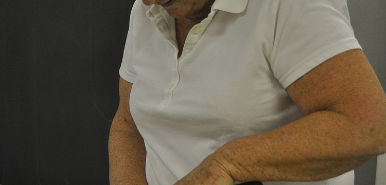 Sous chef Lynn Burton slices apples for the puff pastry dessert.