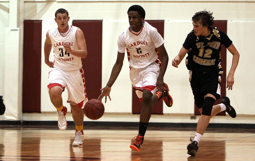 Cardinal Mooneyâ€™s Antonio Blakeley, No. 2, runs up the court with teammate Mitch Arimura, No. 34, and being followed by St. Petersburg Catholicâ€™s Kevin Oâ€™Donnell, No. 12.