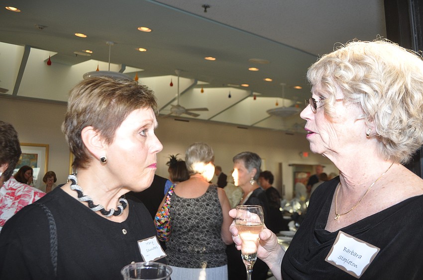 Mary Saunders and Barbara Stapleton catch up at the party.