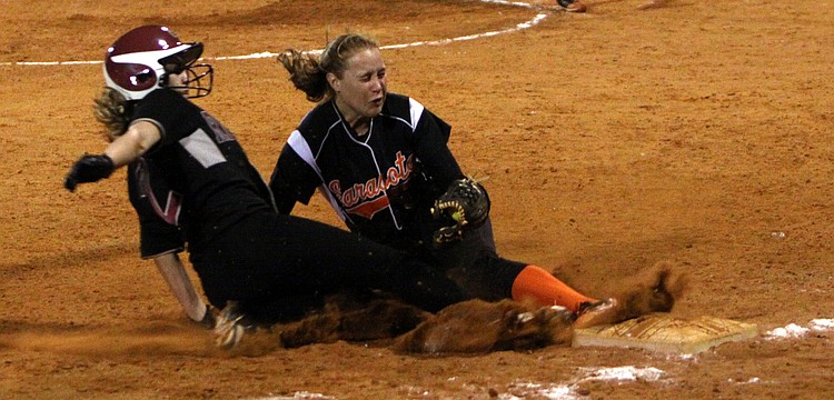 Riverviewâ€™s Courtney Kelly, No. 2, tries to slide into third base but Sarasotaâ€™s Shelby Thorpe, No. 13, beats her to the base and tags her out.