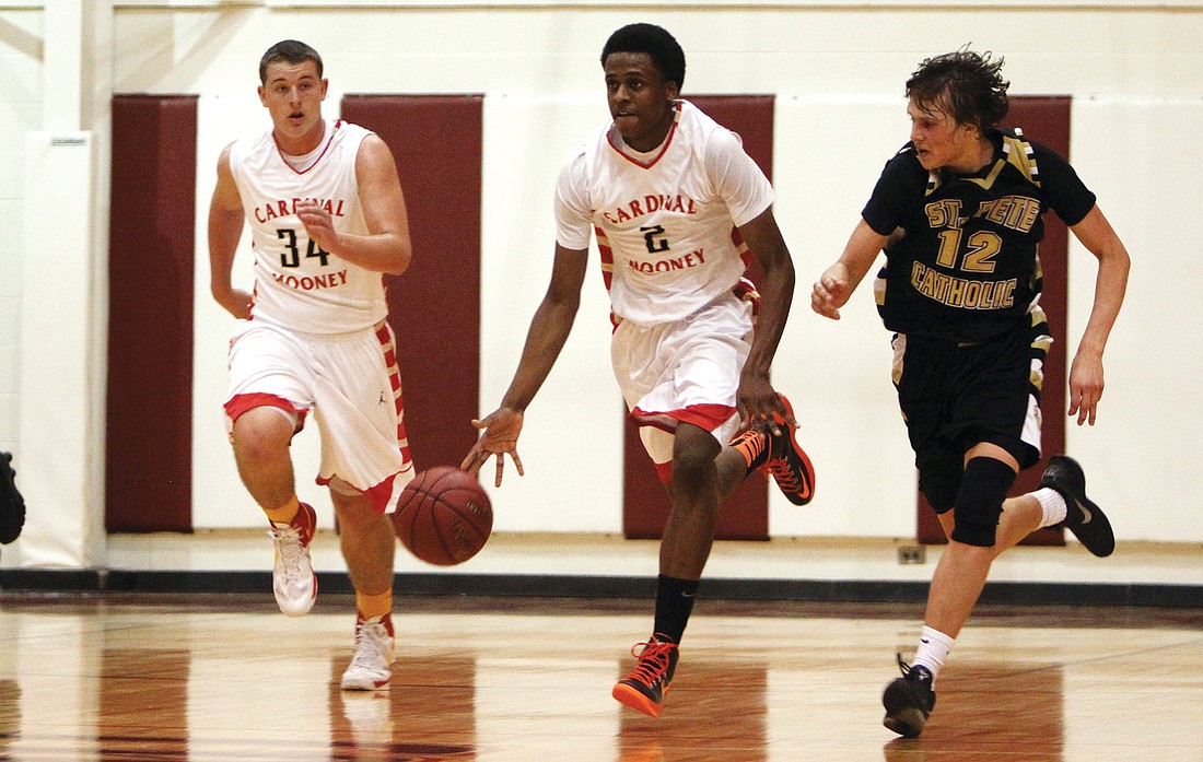 Cardinal Mooney's Antonio Blakeney runs up the court with teammate Mitch Arimura, and being followed by St. Petersburg Catholic's Kevin OÃ¢â‚¬â„¢Donnell.Photos