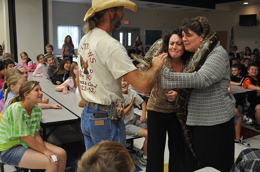 Second grade teacher Gina Sprague and Tia Henderson, acting assistant principal, had their first intimate encounter with a python.