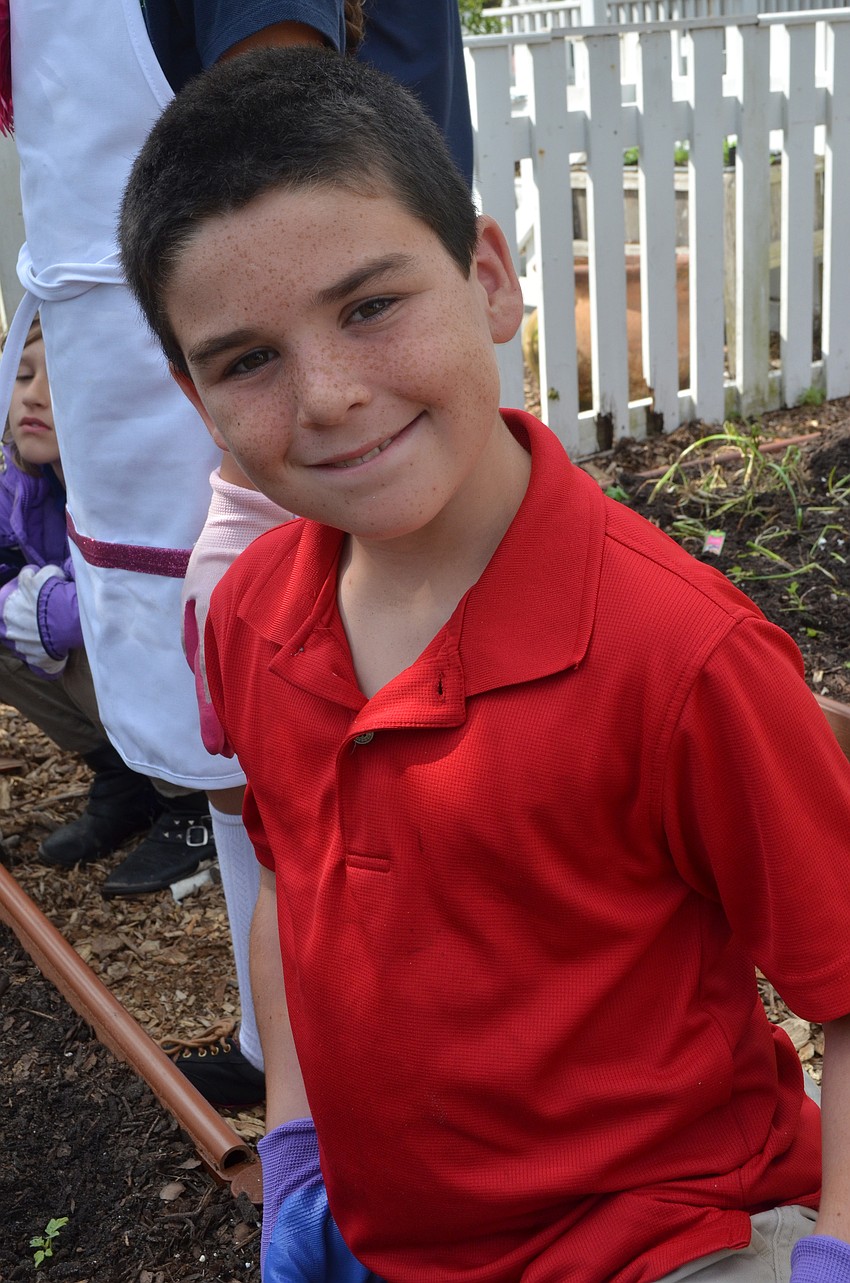 Aiden Pearson spends his recess working on the salsa garden.