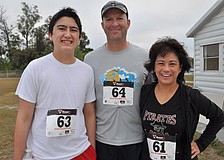 Michael Bennett ran with his parents, Trey and Arlene Bennett.