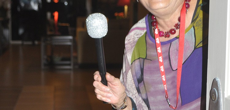 Dale Sprintz welcomed guests with a red carpet and fake microphone.