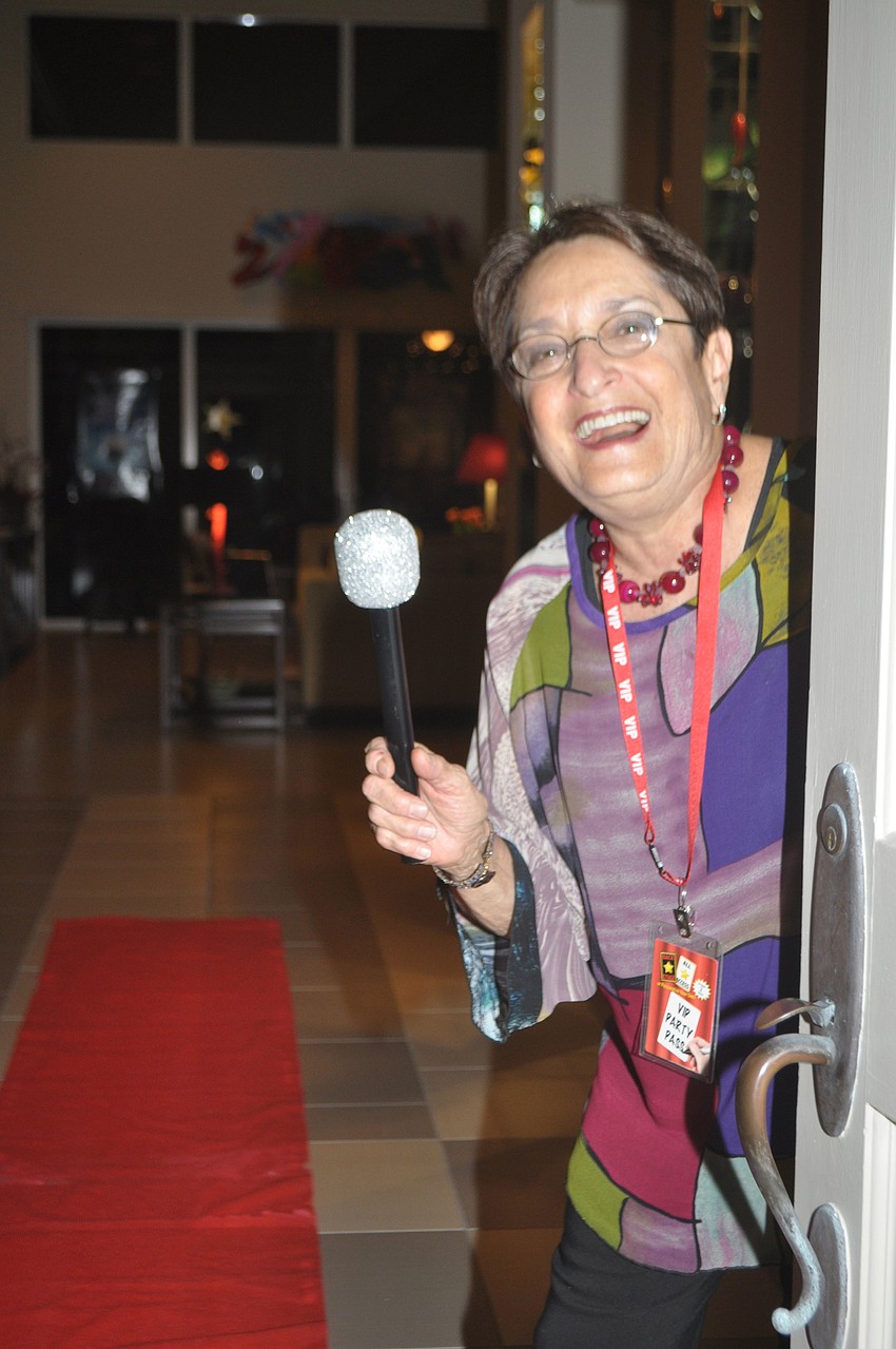 Dale Sprintz welcomed guests with a red carpet and fake microphone.