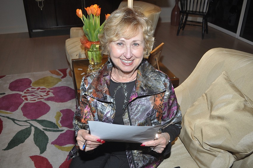 Lois Singer pauses from filling out her ballot.