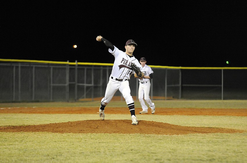 Braden River pitcher Eric Schappacher throws back to first base in an attempt to pick off a Lakewood Ranch base runner.