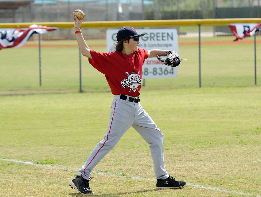 Eleven-year-old Alen Bass warms up before the start of his teamâ€™s season opener Feb. 23.