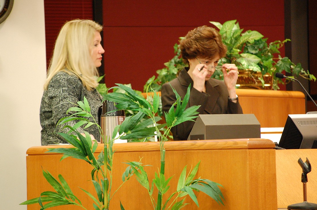 Sarasota County staff members Brenda Bair and Carolyn Brown discuss the Lido Beach restroom project Feb. 26.