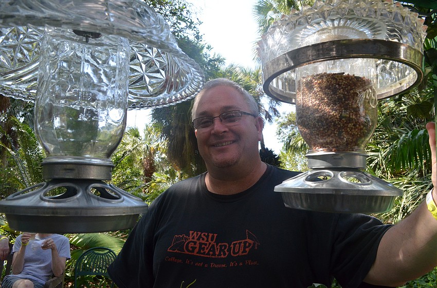 Jack Williams makes bird feeders out of recycled glass. This is his first year as a vendor with his business A Touch of Glass.
