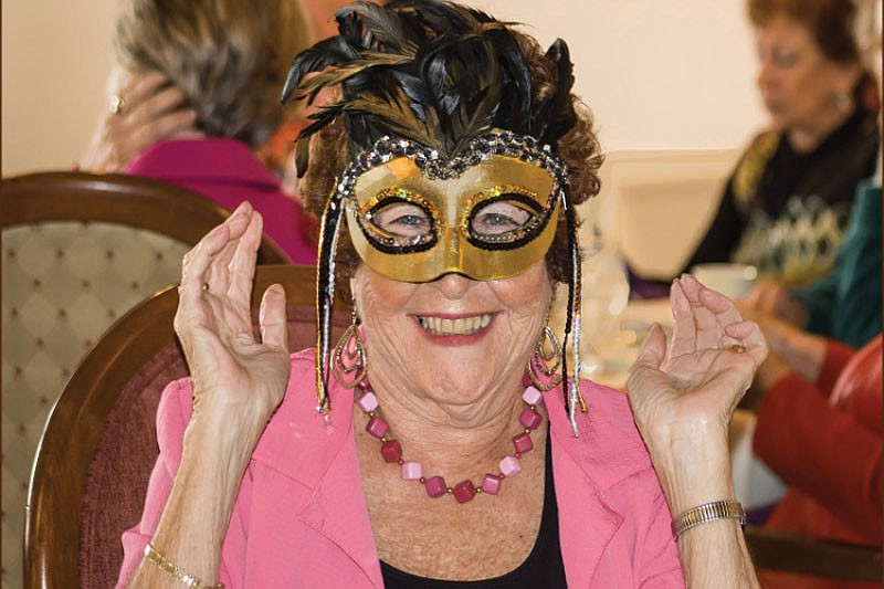 Evonn Collins, of the club's Ways and Means Committee, sported a Mardi Gras mask for fun. Photo by Be-Be Hansen.