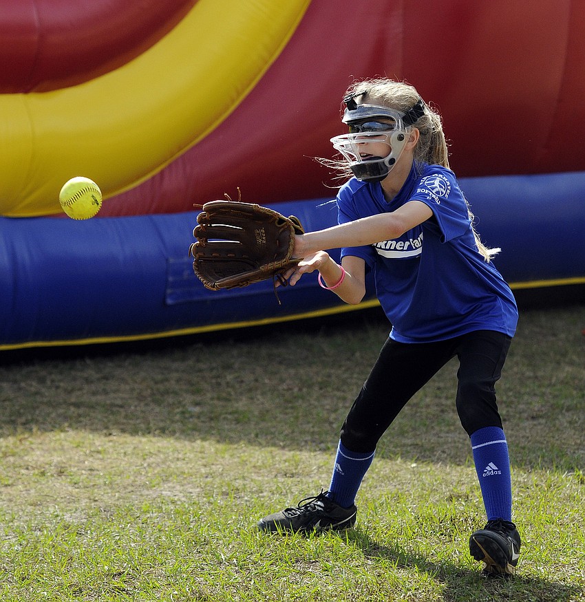 Ten-year-old Deklyn Falkner warms up before the start of her season-opener.