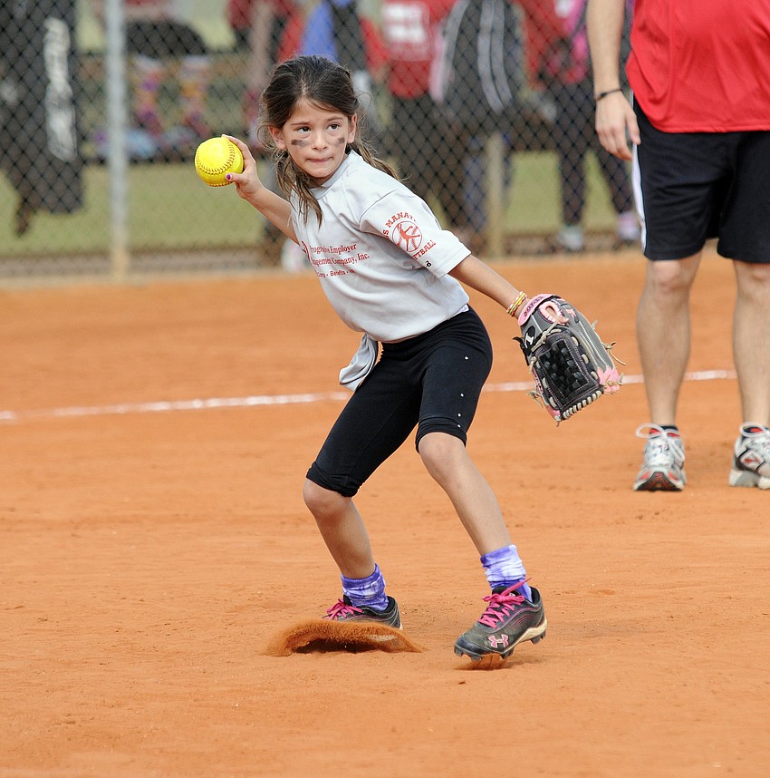 Pemco pitcher Samantha Rees, 8, throws the ball back to first base.