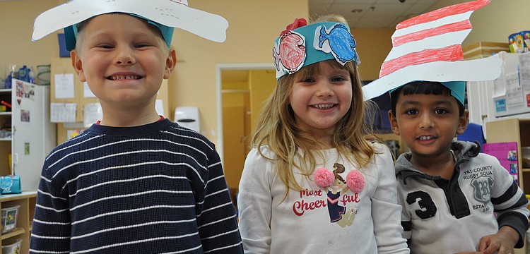 Michael Cole, Addison Weimann and Vedant Singh like wearing the hats they created.