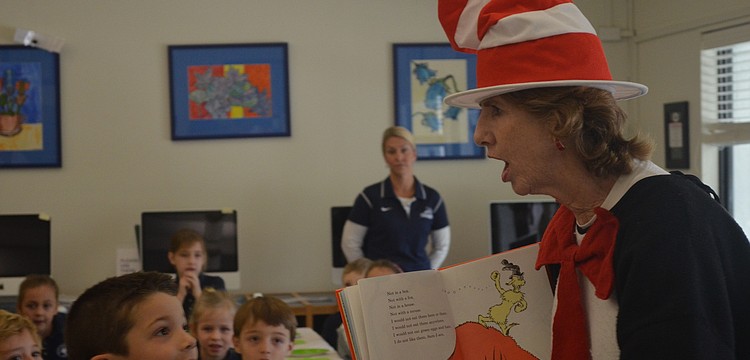 Librarian Glendy Huene reads Green, Eggs and Ham to first graders.