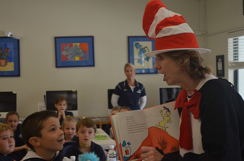 Librarian Glendy Huene reads Green, Eggs and Ham to first graders.