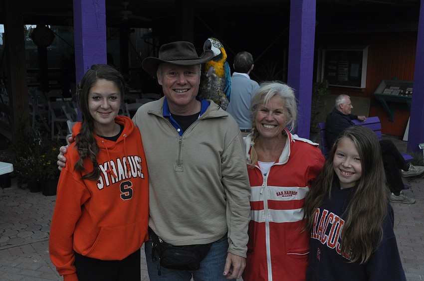 Mackenzie, Greg, Pearl and Maddie Para with Chico the parrot