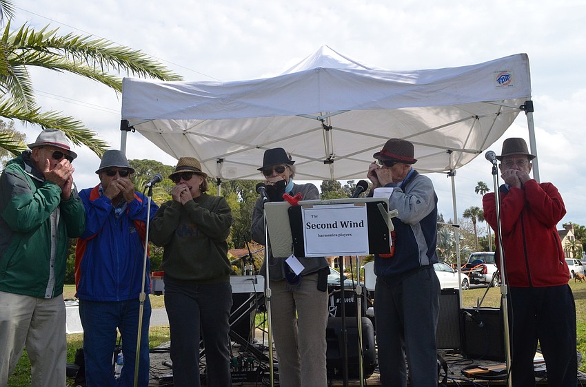 The Second Wind harmonica players performed for festivalgoers.