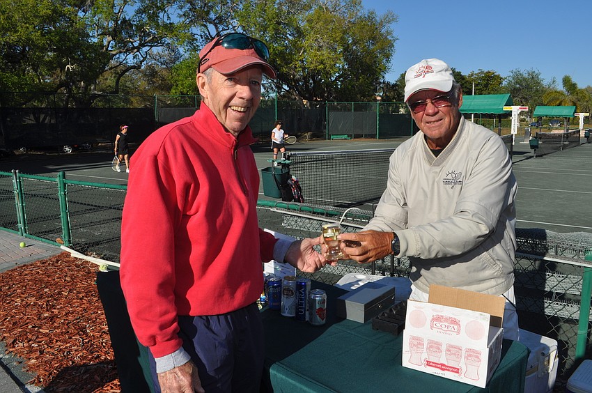 Joe Longtin and Jim Purcell enjoy a beverage.