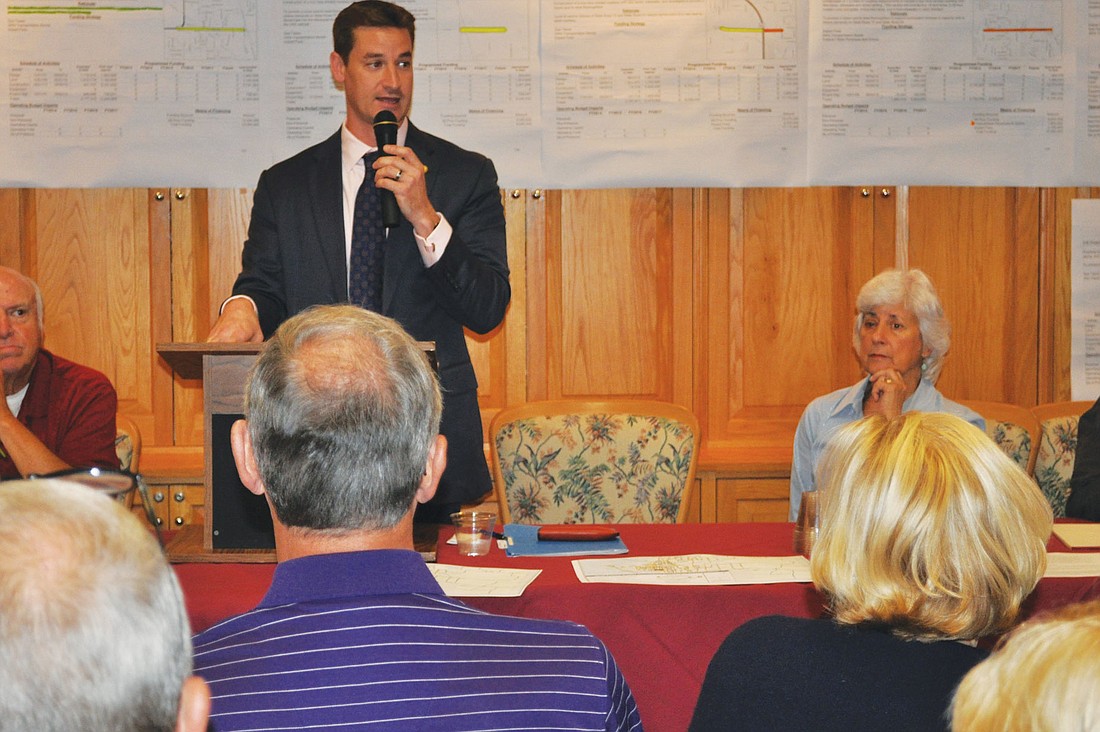 State Rep. Greg Steube urged Peridia residents to get organized and work with Manatee County commissioners to get the 44th Avenue East extension project stopped at U.S. 301. Peridia residents Peter Schneider and Loretto Sadkin sat next to him.
