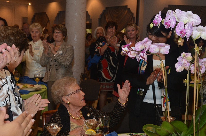 Bea Friedman blows kisses in gratitude to lunch goers for their standing ovation for her Guardian of Israel award.