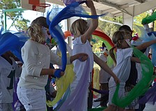 First graders performed a Peruvian bird dance with masks.