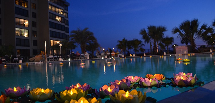 Residents paid attention to detail and decorated the pool with floating lily pad candles.