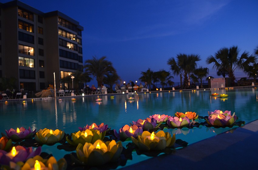 Residents paid attention to detail and decorated the pool with floating lily pad candles.