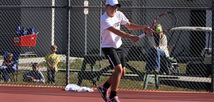 Riverviewâ€™s Michael Moore hits a backhand shot.