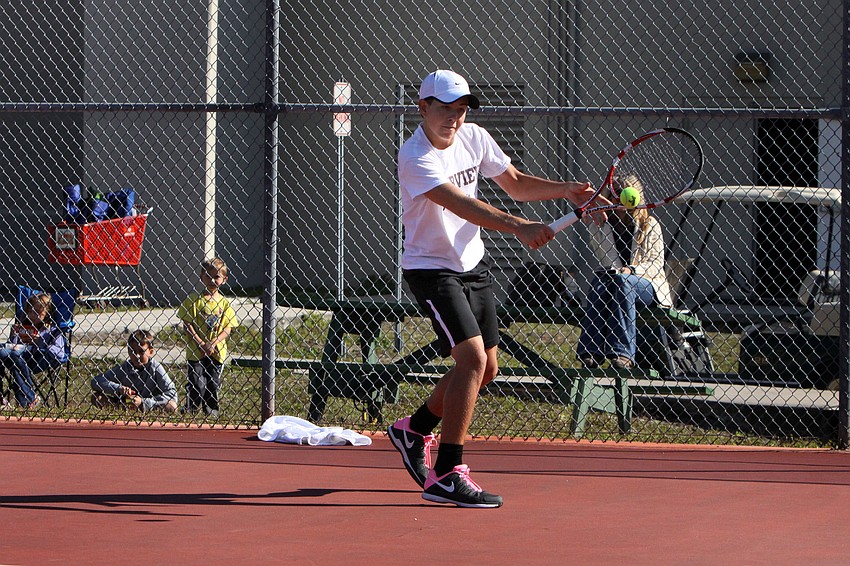 Riverviewâ€™s Michael Moore hits a backhand shot.