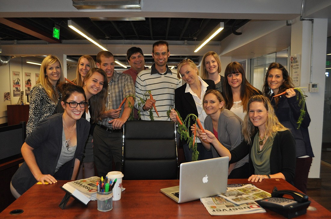 The Observer staff bribing its new boss with carrots. Invisible bosses are the best. Courtesy photo.