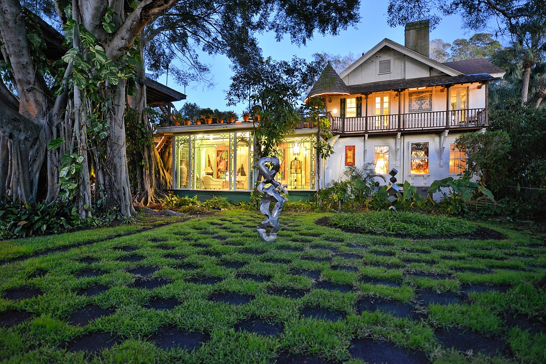 A checkerboard lawn dotted with modern sculpture is just one of the surprises in the gardens that surround the historic Austin/Chaplain home in Whitfield Estates. Photo courtesy of Detlev von Kessel and Coldwell Banker.