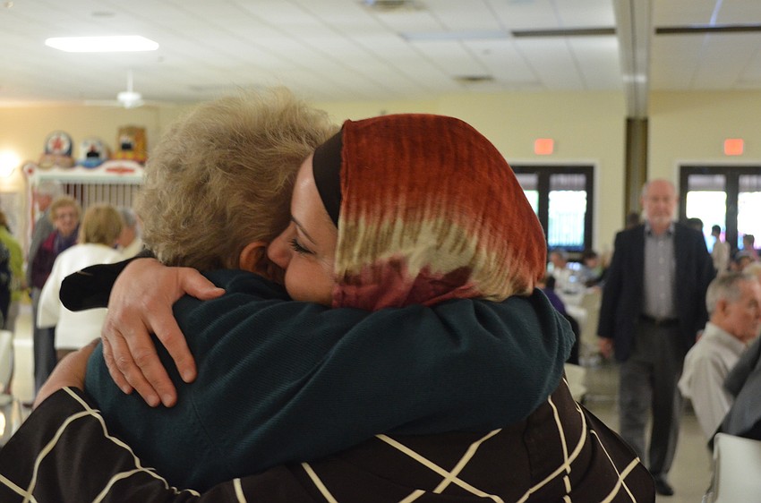 Nasareen Sawaf and Pat Dever met each other at the Feast of Abraham 10 years ago and have stayed friends since. They embrace each other after not seeing each other in a long time.