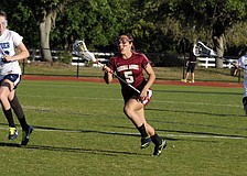 Cardinal Mooney midfielder Rocky Cartaya brings the ball up the field during the Lady Cougars 11-2 victory over ODA March 13.