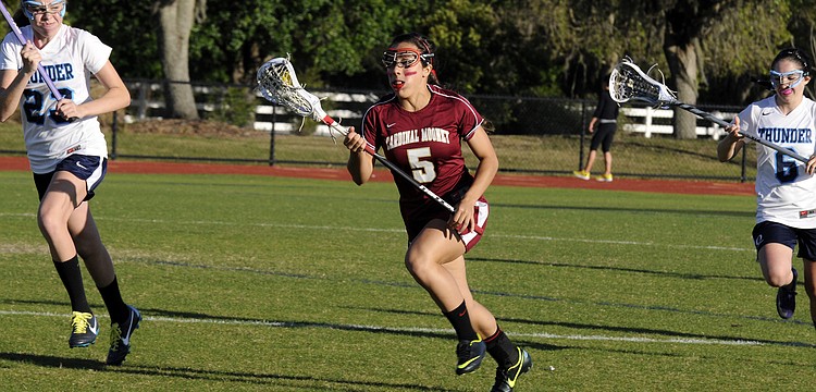 Cardinal Mooney midfielder Rocky Cartaya brings the ball up the field during the Lady Cougars 11-2 victory over ODA March 13.