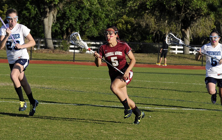 Cardinal Mooney midfielder Rocky Cartaya brings the ball up the field during the Lady Cougars 11-2 victory over ODA March 13.