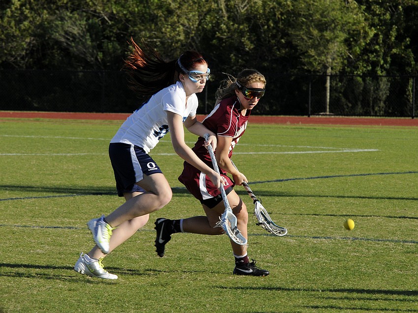ODAâ€™s Amelia Summersbee battles Cardinal Mooneyâ€™s Kelly Nicholson for possession in the first half.