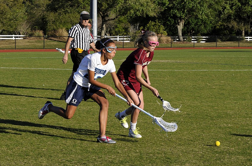 ODAâ€™s Lexi Meyers and Cardinal Mooneyâ€™s Alex Jungers battle for the ball.
