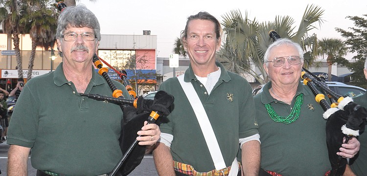 Bob Fair, Jay Connelly and Jack States pose on a break from bagpipe playing.