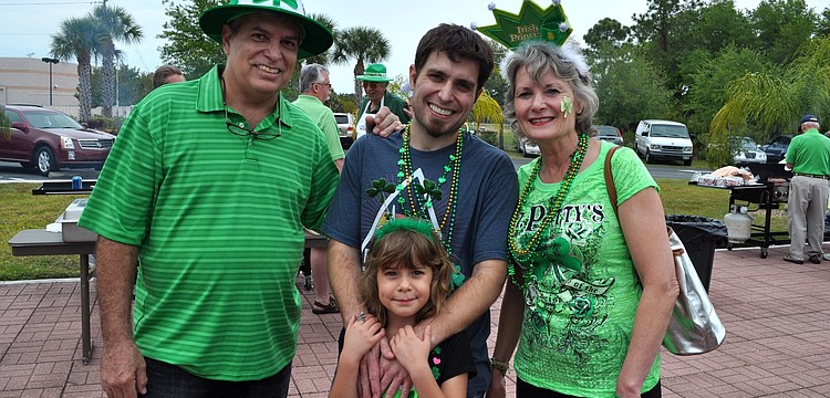Rick Marot along with his son Dan, granddaughter Ava, 7, and wife Charlene all got into the spirit of the party with beads, hats, headbands and crowns.