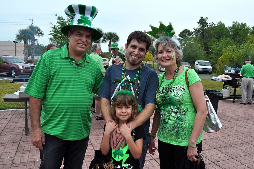 Rick Marot along with his son Dan, granddaughter Ava, 7, and wife Charlene all got into the spirit of the party with beads, hats, headbands and crowns.