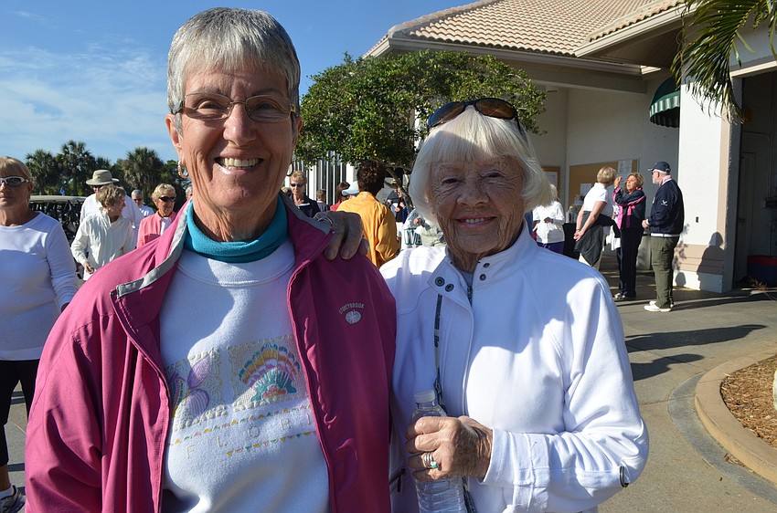 Judy Cowgill and Fay Baxter leave the Stoneybrook Club House Saturday morning and set off on their walk.