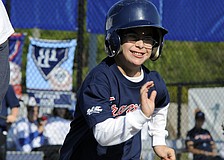 Payton Aaron couldnâ€™t contain his enthusiasm has he raced down the first base line.